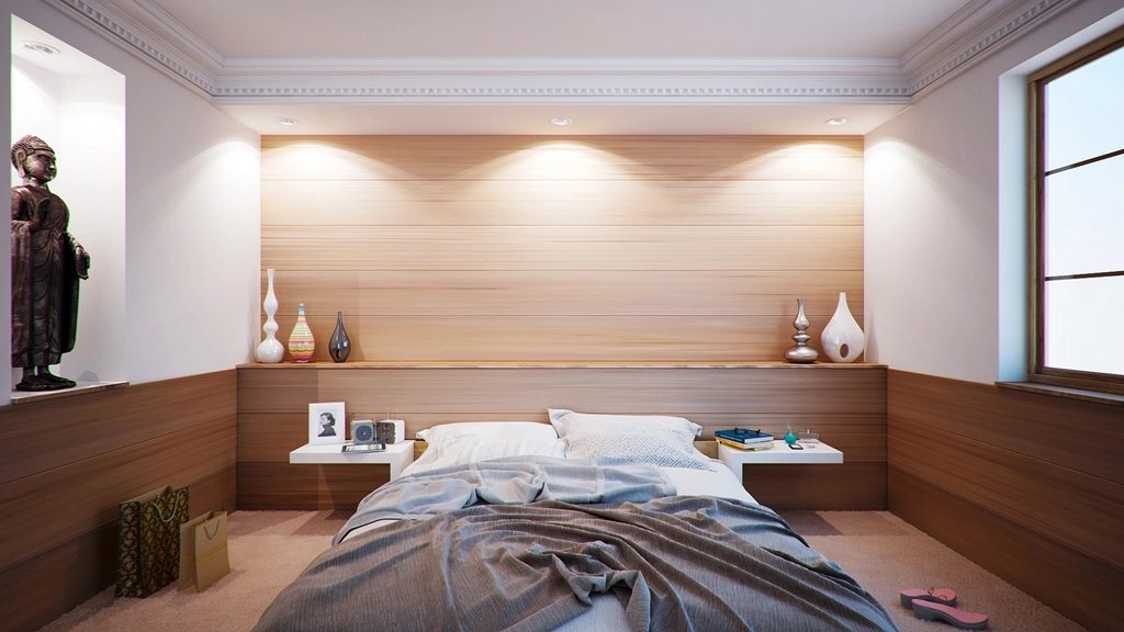 A warm, neutral bedroom interior.