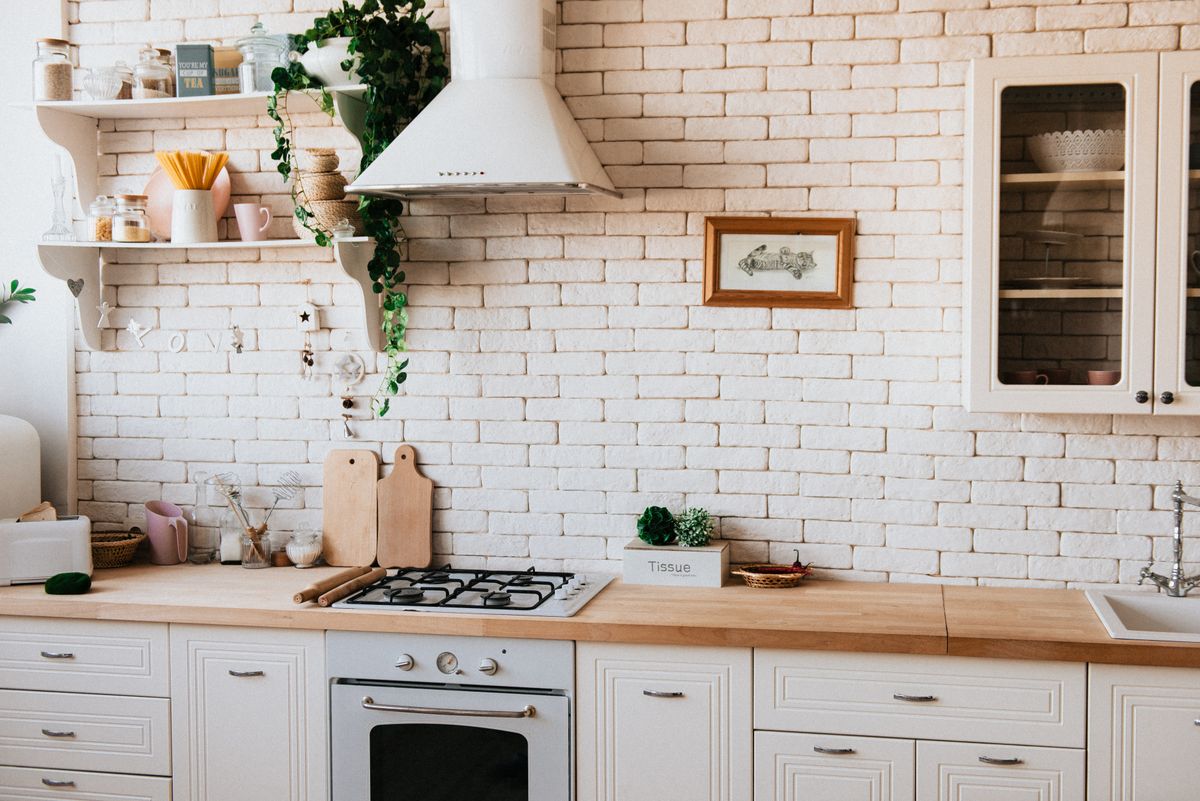 A kitchen with wooden counters and organized surfaces.